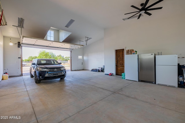 7738 N 185th Ave, Waddell, AZ 85355 - garage featuring freestanding refrigerator and a ceiling fan