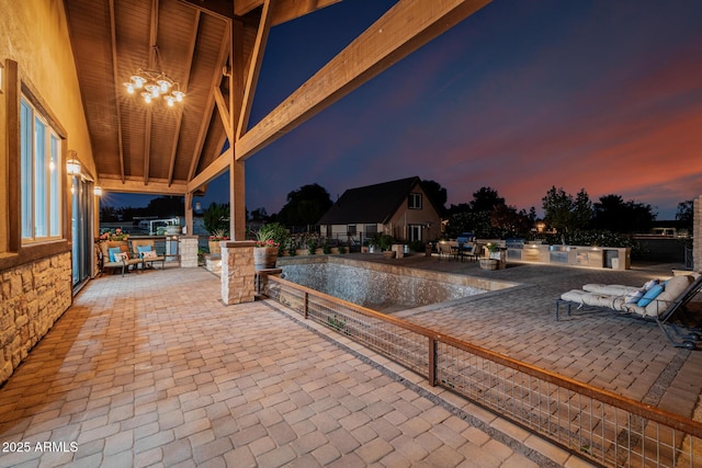 7738 N 185th Ave, Waddell, AZ 85355 - pool at dusk featuring a patio and an outdoor pool