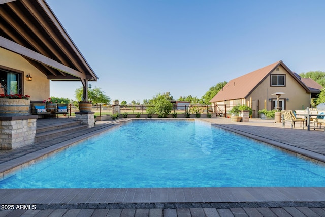 7738 N 185th Ave, Waddell, AZ 85355 - view of swimming pool with a fenced in pool, fence, and a patio area