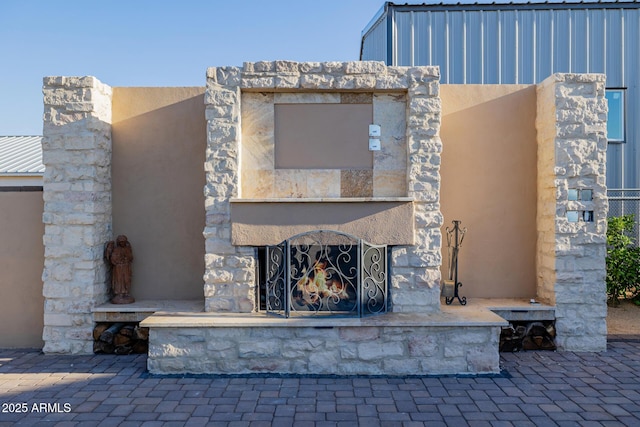 7738 N 185th Ave, Waddell, AZ 85355 - exterior space with an outdoor stone fireplace