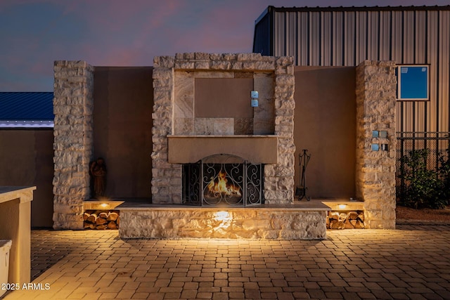 7738 N 185th Ave, Waddell, AZ 85355 - view of patio featuring an outdoor stone fireplace