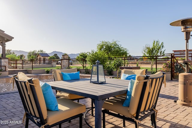 7738 N 185th Ave, Waddell, AZ 85355 - view of patio featuring outdoor dining area, a mountain view, and fence