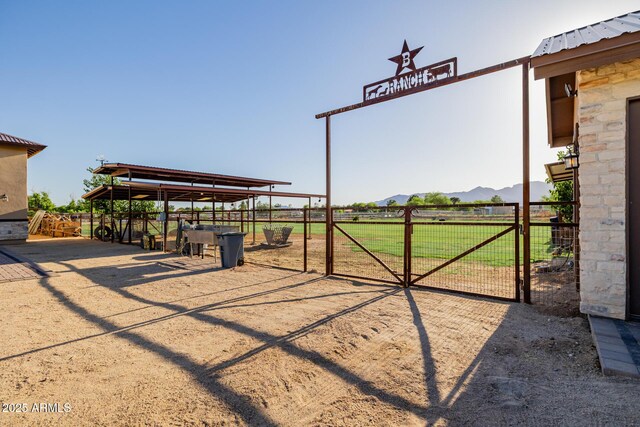7738 N 185th Ave, Waddell, AZ 85355 - exterior space featuring fence, a gate, and a mountain view