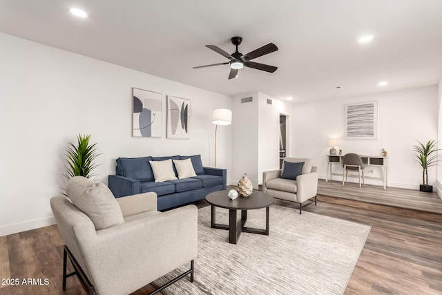 living room featuring ceiling fan and wood-type flooring