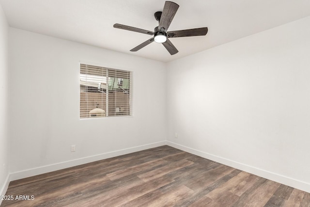 unfurnished room with dark hardwood / wood-style flooring and ceiling fan