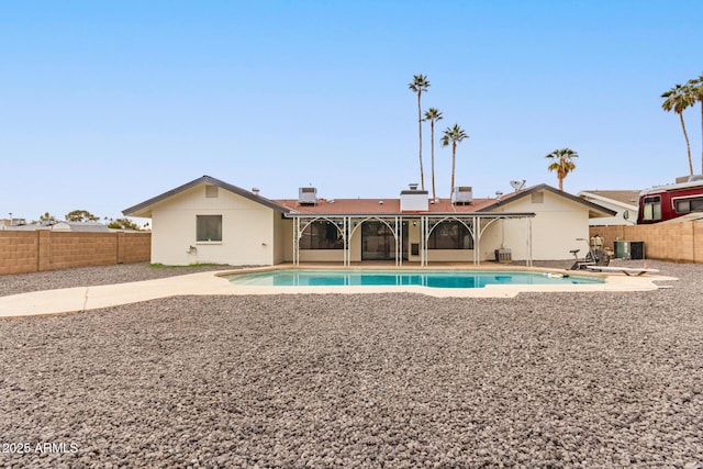 view of pool with a patio and central AC