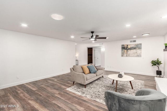 living room with hardwood / wood-style floors and ceiling fan