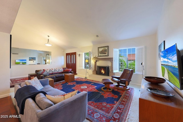 3417 E Mission Ln E, Phoenix, AZ 85028 - living area featuring baseboards, a lit fireplace, and lofted ceiling