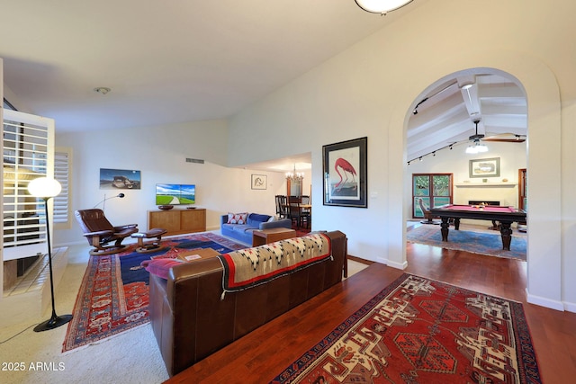 3417 E Mission Ln E, Phoenix, AZ 85028 - living area with arched walkways, billiards table, wood finished floors, ceiling fan, and baseboards