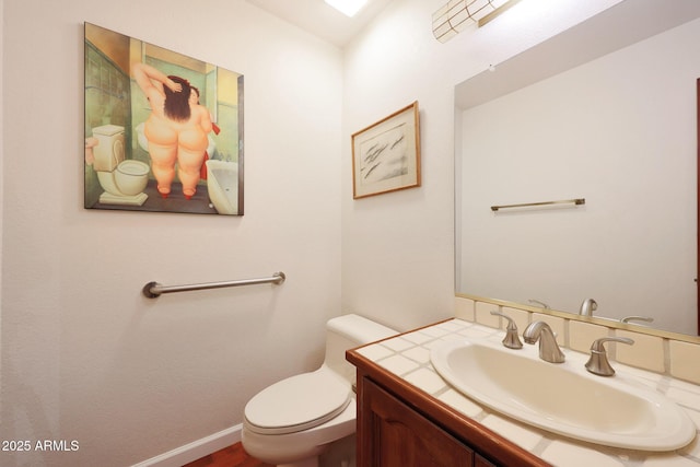 3417 E Mission Ln E, Phoenix, AZ 85028 - bathroom with toilet, vanity, and baseboards