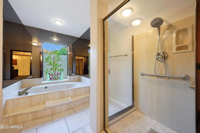 3417 E Mission Ln E, Phoenix, AZ 85028 - bathroom featuring a shower stall, a garden tub, and tile patterned flooring