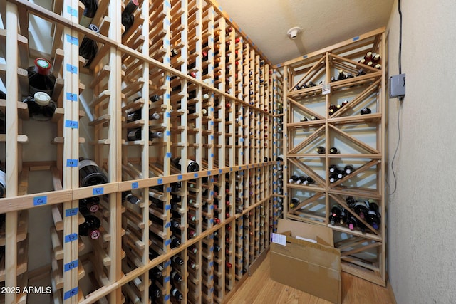 3417 E Mission Ln E, Phoenix, AZ 85028 - wine cellar with wood finished floors and a textured wall