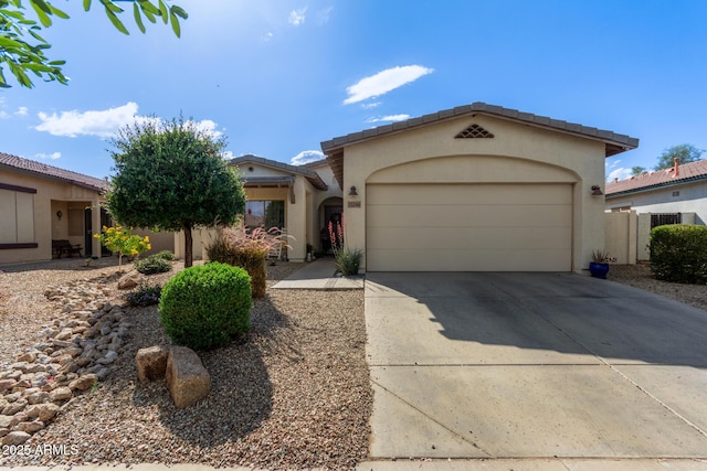 15246 N 138th Ln, Surprise, AZ 85379 - mediterranean / spanish house with a garage, driveway, and stucco siding