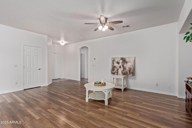 15246 N 138th Ln, Surprise, AZ 85379 - living room with arched walkways, wood finished floors, visible vents, and a ceiling fan