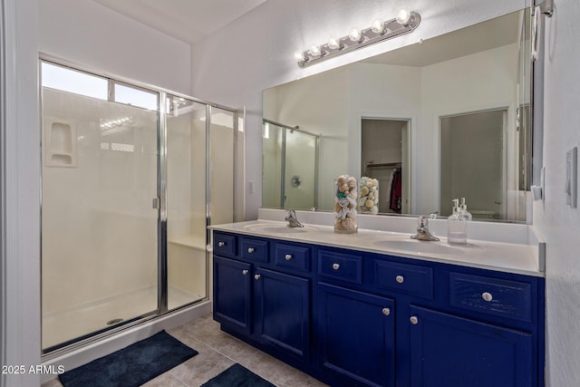 15246 N 138th Ln, Surprise, AZ 85379 - full bath with double vanity, a shower stall, tile patterned flooring, and a sink
