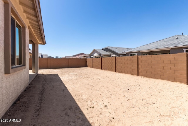 view of yard with a fenced backyard