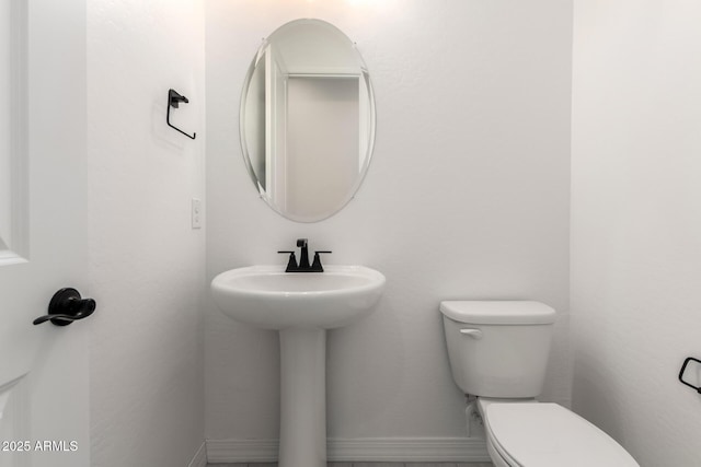 bathroom featuring toilet