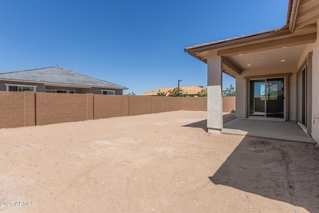view of yard with a patio and a fenced backyard