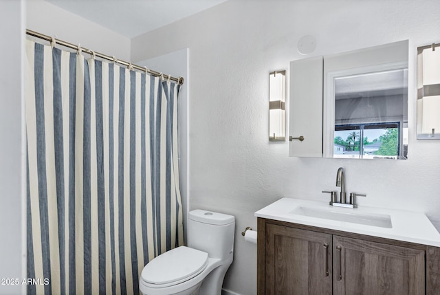 1017 E Maryland Ave Unit 236, Phoenix, AZ 85014 - bathroom with toilet, vanity, a textured wall, and curtained shower