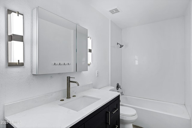 1017 E Maryland Ave Unit 236, Phoenix, AZ 85014 - bathroom featuring toilet, visible vents, shower / tub combination, vanity, and a textured wall