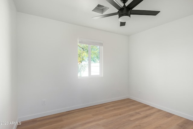 spare room featuring light wood-type flooring and ceiling fan