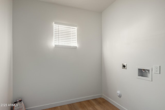 laundry room with hookup for a washing machine, hardwood / wood-style floors, and hookup for an electric dryer