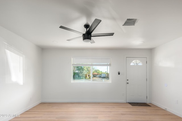 foyer with light hardwood / wood-style floors and ceiling fan