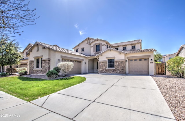 6192 S Claiborne Ave, Gilbert, AZ 85298 - mediterranean / spanish-style house featuring concrete driveway, stucco siding, stone siding, and a garage