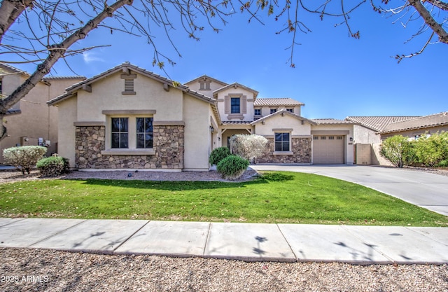 6192 S Claiborne Ave, Gilbert, AZ 85298 - mediterranean / spanish-style house with concrete driveway, stucco siding, stone siding, and a garage