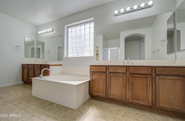 6192 S Claiborne Ave, Gilbert, AZ 85298 - full bathroom with a bath, vanity, tile patterned flooring, a stall shower, and baseboards