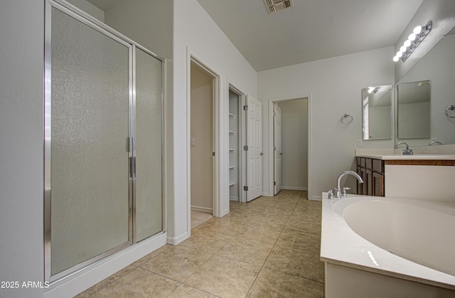 6192 S Claiborne Ave, Gilbert, AZ 85298 - bathroom featuring a shower stall, a garden tub, vanity, and visible vents