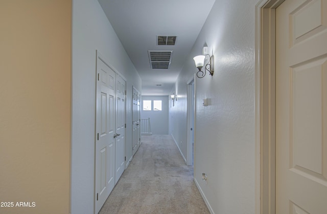 6192 S Claiborne Ave, Gilbert, AZ 85298 - hallway featuring light colored carpet, baseboards, and visible vents