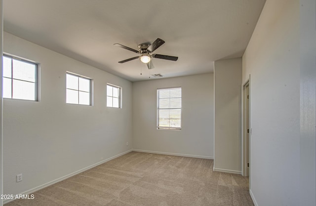 6192 S Claiborne Ave, Gilbert, AZ 85298 - spare room featuring light carpet, baseboards, and a ceiling fan
