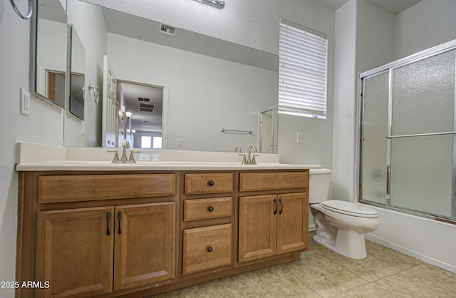 6192 S Claiborne Ave, Gilbert, AZ 85298 - full bathroom featuring shower / bath combination with glass door, toilet, a sink, tile patterned floors, and double vanity