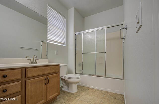 6192 S Claiborne Ave, Gilbert, AZ 85298 - bathroom with toilet, tile patterned floors, vanity, and combined bath / shower with glass door