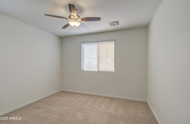 6192 S Claiborne Ave, Gilbert, AZ 85298 - unfurnished room featuring visible vents, ceiling fan, light carpet, and baseboards