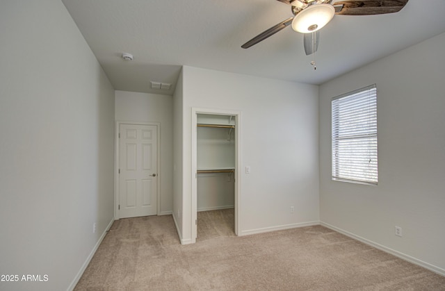 6192 S Claiborne Ave, Gilbert, AZ 85298 - unfurnished bedroom with a closet, light colored carpet, visible vents, a walk in closet, and baseboards