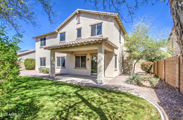 6192 S Claiborne Ave, Gilbert, AZ 85298 - rear view of house with a yard, a fenced backyard, a tile roof, a patio, and stucco siding