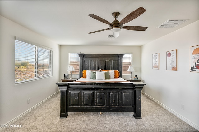 bedroom featuring light carpet and ceiling fan