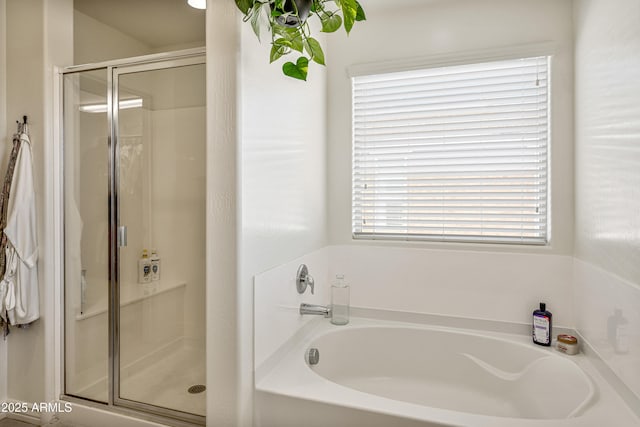 bathroom with separate shower and tub