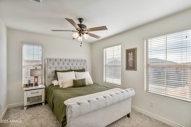 bedroom with light carpet and ceiling fan