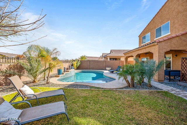 view of pool featuring a yard