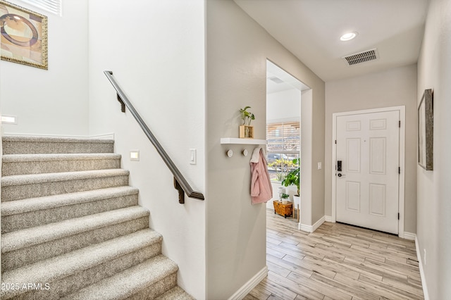 foyer with light hardwood / wood-style floors