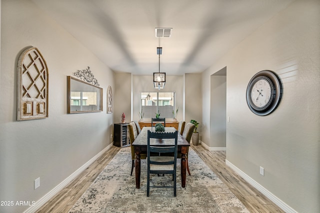 dining area with hardwood / wood-style flooring