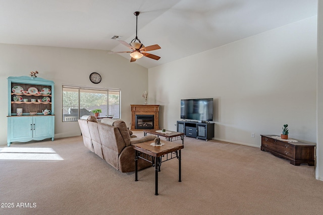 living room featuring ceiling fan, high vaulted ceiling, and light carpet