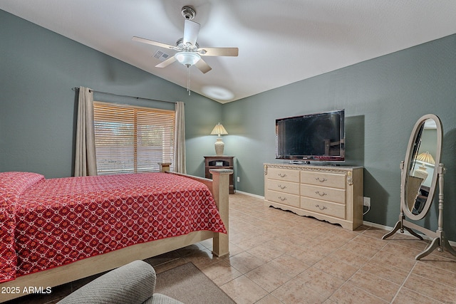 bedroom with vaulted ceiling, light tile patterned floors, and ceiling fan