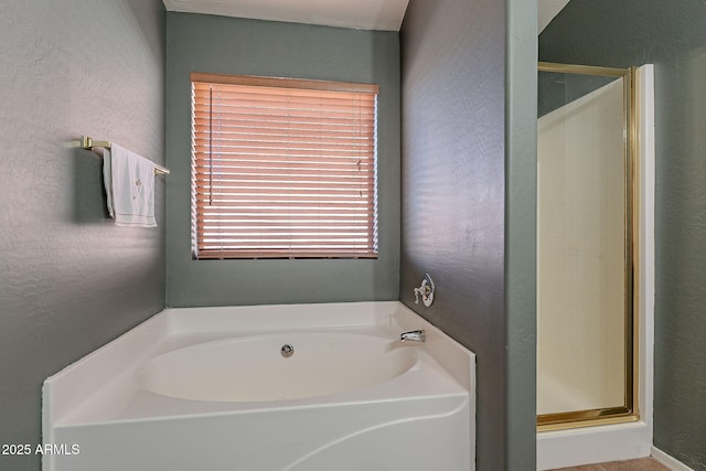 bathroom with separate shower and tub