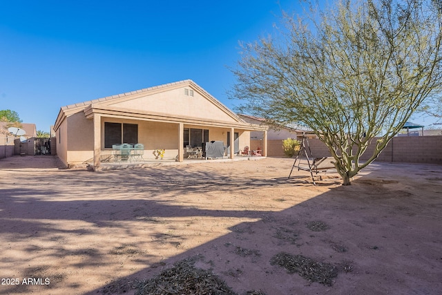 back of property with a patio area