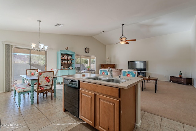 kitchen with pendant lighting, sink, black dishwasher, an island with sink, and light carpet