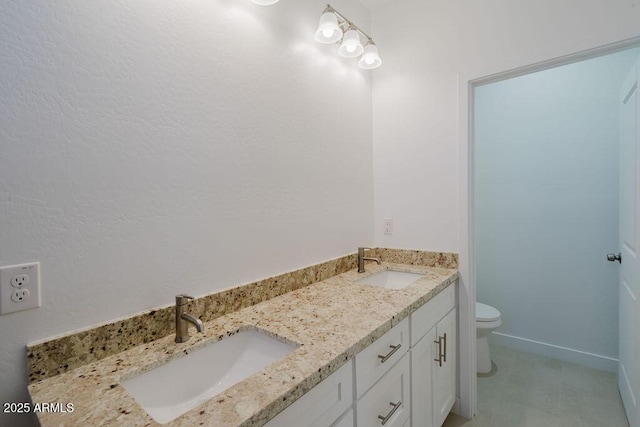 bathroom featuring toilet and vanity